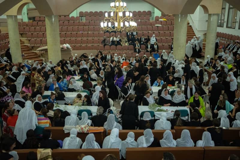 Women mourn during the funeral of their relatives at the Druze town of Majdal Shams.  Twelve children and young people were killed when a rocket fired by the Iran-backed Hezbollah militia in southern Lebanon hit a football field in the Israeli-occupied Golan Heights. Ilia Yefimovich/dpa