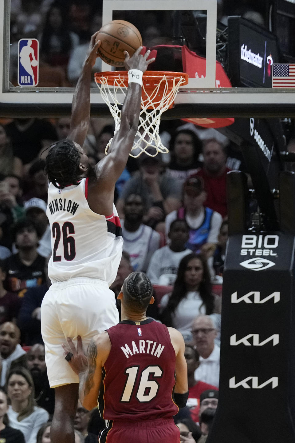 Portland Trail Blazers forward Justise Winslow (26) dunks the ball against Miami Heat forward Caleb Martin (16) during the second half of an NBA basketball game, Monday, Nov. 7, 2022, in Miami. (AP Photo/Wilfredo Lee)