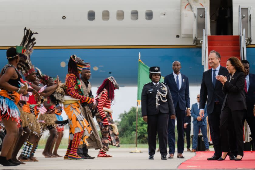 LUSAKA, ZAMBIA - MARCH 31: Vice President Kamala Harris and Second Gentleman Doug Emhoff are welcomed by Zambia Vice President W.K. Mutale Nalumango and her husband Max Lubinda Nalumango at Kenneth Kuanda International Airport on Friday, March 31, 2023 in Lusaka, Zambia. (Kent Nishimura / Los Angeles Times)