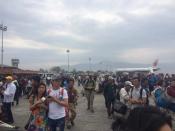 People stand on the runway outside the International Terminal after a earthquake hit, at Tribhuvan International Airport, Kathmandu, Nepal, April 25, 2015, in this handout courtesy of Dhany Osman. The massive earthquake measuring 7.9 magnitude struck 80 km (50 miles) east of Pokhara in Nepal on Saturday, causing some buildings in the capital Kathmandu to collapse, witnesses said. REUTERS/Dhany Osman/Handout via Reuters TPX IMAGES OF THE DAY ATTENTION EDITORS - THIS PICTURE WAS PROVIDED BY A THIRD PARTY. REUTERS IS UNABLE TO INDEPENDENTLY VERIFY THE AUTHENTICITY, CONTENT, LOCATION OR DATE OF THIS IMAGE. NO SALES. NO ARCHIVES. FOR EDITORIAL USE ONLY. NOT FOR SALE FOR MARKETING OR ADVERTISING CAMPAIGNS. THIS PICTURE IS DISTRIBUTED EXACTLY AS RECEIVED BY REUTERS, AS A SERVICE TO CLIENTS.