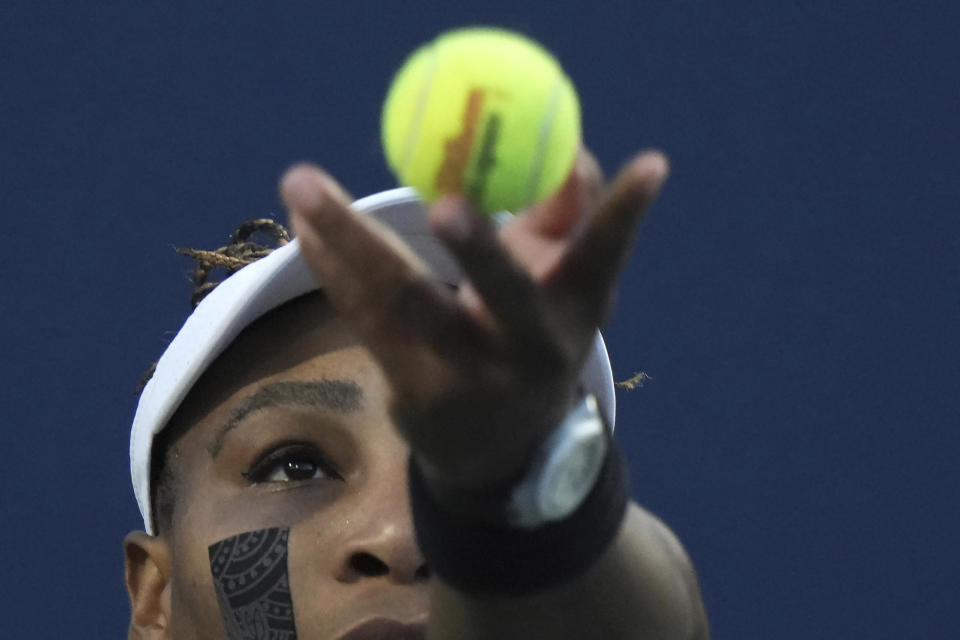 Serena Williams, of the United States, tosses the ball for a serve to Belinda Bencic, of Switzerland, during the National Bank Open tennis tournament Wednesday, Aug. 10, 2022, in Toronto. (Nathan Denette/The Canadian Press via AP)