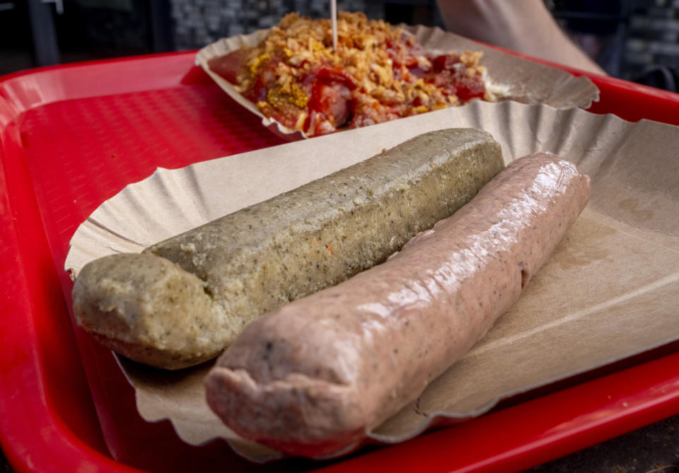 Two types of vegan sausages are displayed at a "Best Worscht in Town" branch in Frankfurt, Germany, Friday, June 16, 2023. In Germany, a country where meat-heavy dishes like schnitzel and bratwurst are a mainstay of diets, a widespread concern about climate and animal welfare have been driving big changes. (AP Photo/Michael Probst)