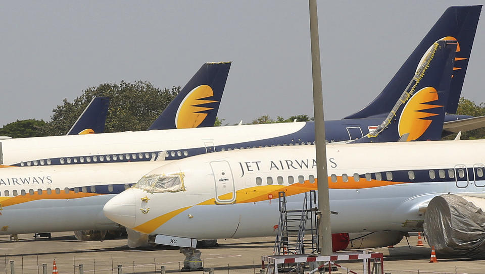 FILE - In this April 15, 2019, file photo, Jet Airways aircrafts are seen parked at Chhatrapati Shivaji Maharaj International Airport in Mumbai. India's Jet Airways said Wednesday, April 17, that it is suspending all operations after failing to raise enough money to run its services. (AP Photo/Rafiq Maqbool, File)