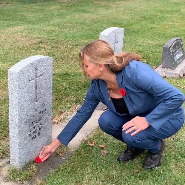 Maureen Bianchini Purvis lays a poppy at her late mother's headstone, a tradition that has turned into a campaign involving tens of thousands of students all across Canada. 