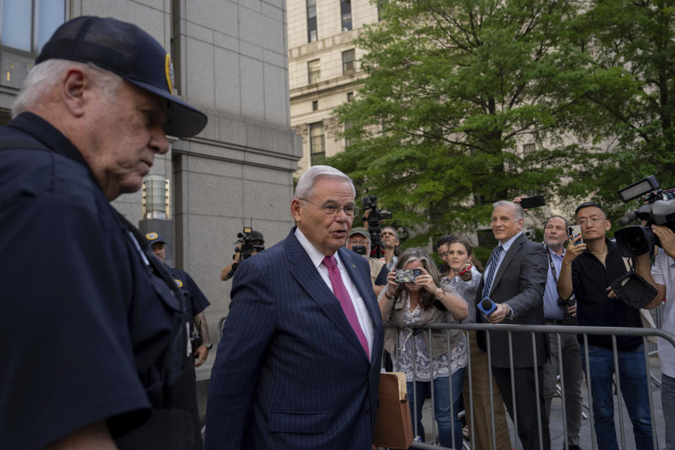 Sen. Bob Menendez, D-N.J., front right, leaves Manhattan federal court, Friday, June 7, 2024, in New York. (AP Photo/Adam Gray)
