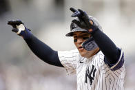 New York Yankees' Jose Trevino reacts after hitting a run-scoring single against the Tampa Bay Rays during the fifth inning of a baseball game Sunday, April 21, 2024, in New York. (AP Photo/Adam Hunger)