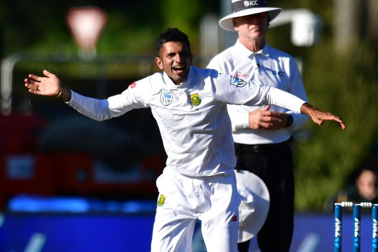 South Africa's Keshav Maharaj celebrates New Zealand's Henry Nicholls being caught on day two of their 1st Test match, at the University Oval in Dunedin, on March 9, 2017