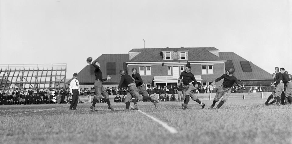 A Rutgers player attempts a forward pass circa 1910. (Bettmann Archive/Getty Images)