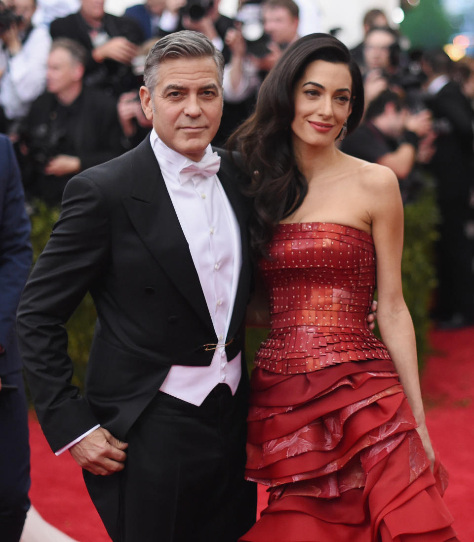 George and Amal smiling for cameras