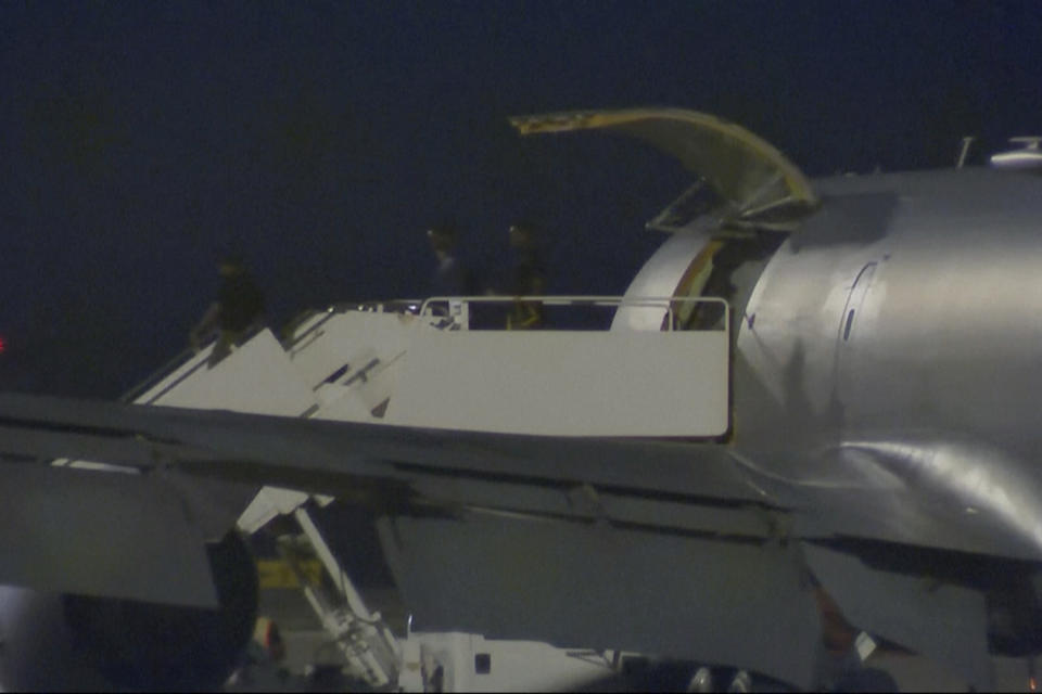 This image made from video provided by KSAT purports to show Pvt. Travis King, second right, coming out of an airplane in San Antonio, Texas, early Thursday, Sept. 28, 2023. The American soldier who sprinted into North Korea across the heavily fortified border between the Koreas two months ago arrived back in the U.S. early Thursday, video appeared to show. (KSAT via AP)