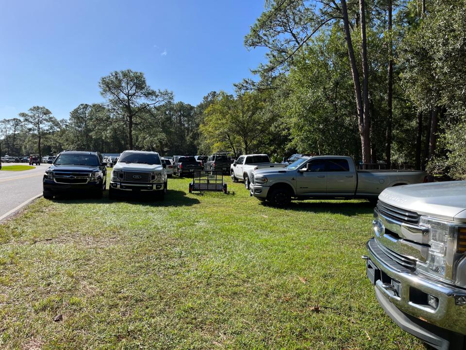 cars parked on grass near fort wilderness