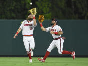 Los Angeles Angels center fielder Brandon Marsh, left, runs in front of right fielder Adam Eaton to catch a fly ball hit by Oakland Athletics' Jed Lowrie in the eighth inning of a baseball game against Friday, July 30, 2021, in Anaheim, Calif. (AP Photo/John McCoy)