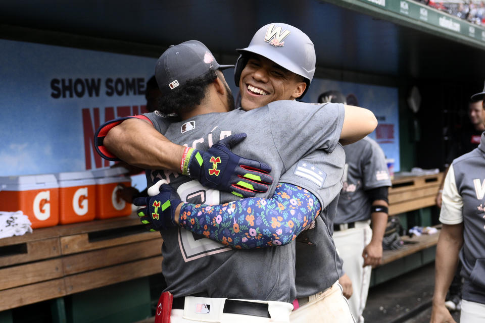 Washington Nationals' Juan Soto, back, celebrates his two-run home run with Luis Garcia, front, during the fifth inning of a baseball game against the Milwaukee Brewers, Saturday, June 11, 2022, in Washington. (AP Photo/Nick Wass)