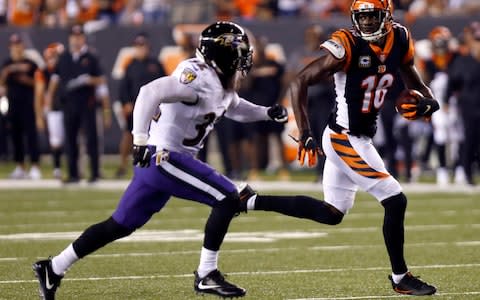 Cincinnati Bengals wide receiver A.J. Green (18) runs against Baltimore Ravens defensive back Eric Weddle (32) for a touchdown during the first half at Paul Brown Stadium - Credit: David Kohl/USA Today