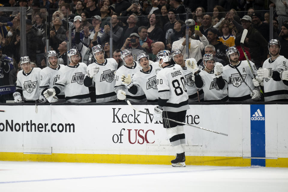 Los Angeles Kings center Pierre-Luc Dubois (80) is congratulated for his goal against the San Jose Sharks during the second period of an NHL hockey game Wednesday, Dec. 27, 2023, in Los Angeles. (AP Photo/Kyusung Gong)