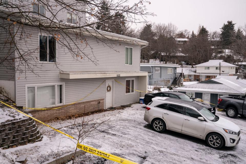 Police tape surrounds the home that was the site of the quadruple murder (Getty Images)