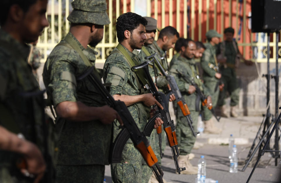 Yemeni Shiite fighters stand guard during a protest against U.S. President Donald Trump's Mideast plan in Sanaa, Yemen, Friday, Jan. 31, 2020. (AP Photo/Hani Mohammed)