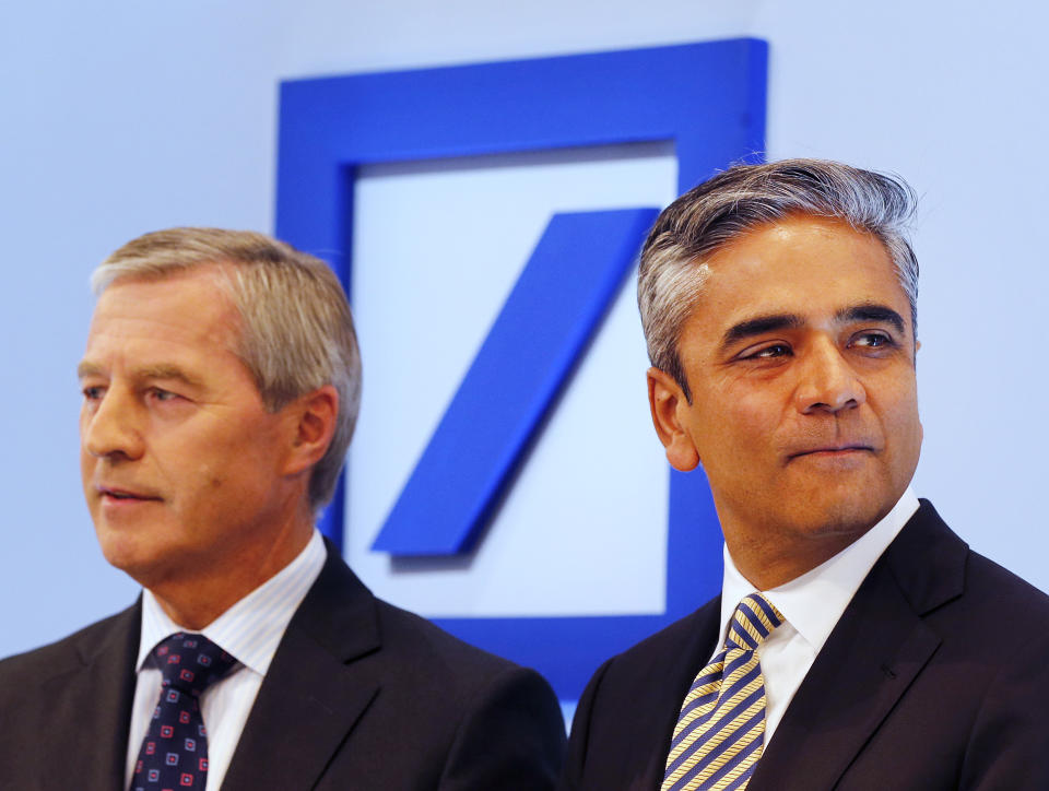 CEOs of Deutsche Bank Anshu Jain, right, and Juergen Fitschen stand together prior to the beginning of a press conference in Frankfurt, Germany, Tuesday, Sept. 11, 2012. The Deutsche Bank announced its strategy and ambition for the next years. (AP Photo/Michael Probst)