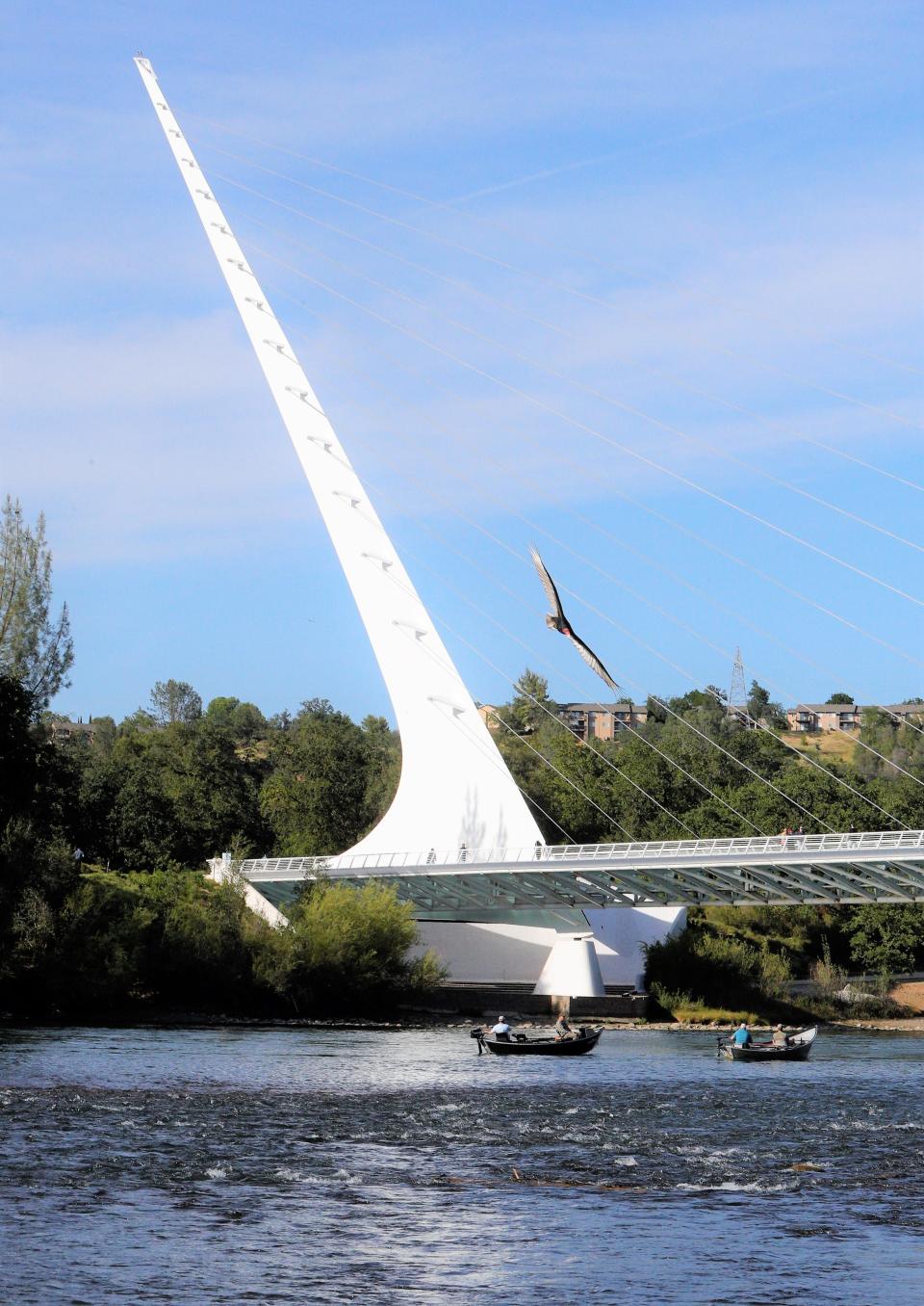 Boaters float on the Sacramento River beneath Redding's Sundial Bridge on Tuesday, May 3, 2022.