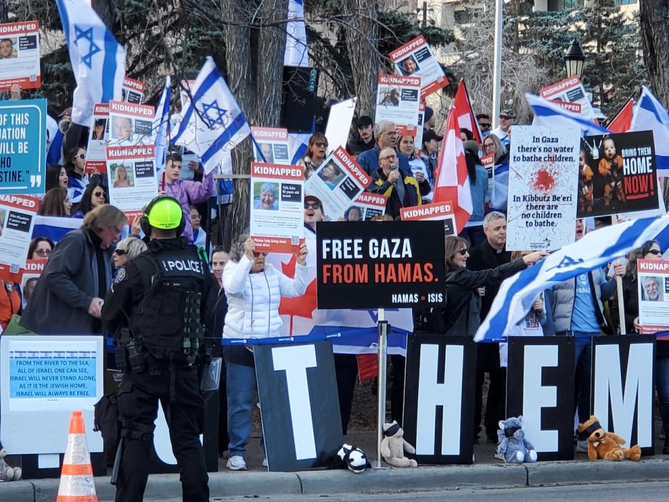 A large pro-Israel rally was held on Sunday in Calgary, right across the street from the pro-Palestinian demonstration. Jewish groups have described the phrase that resulted in Wesam Cooley's arrest as antisemitic, and say it advocates driving Jews out of Israel.