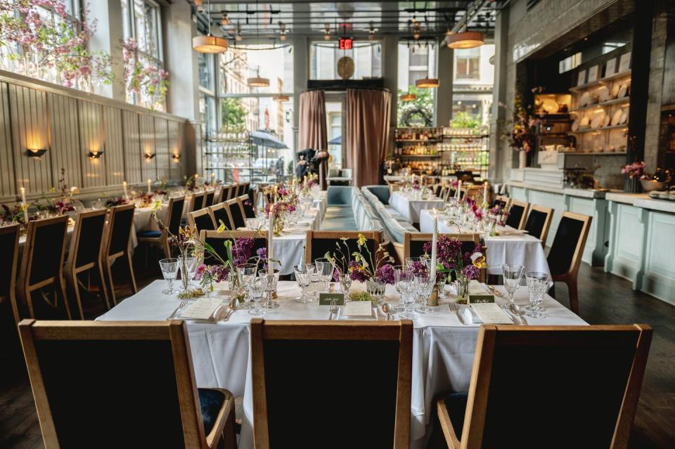 a large dining room with tables set