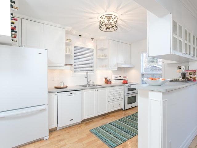 <p><a rel="nofollow noopener" href="https://www.zoocasa.com/toronto-on-real-estate/5105224-224-browning-ave-toronto-on-m4k1x2-e4051817" target="_blank" data-ylk="slk:224 Browning Ave., Toronto, Ont.;elm:context_link;itc:0;sec:content-canvas" class="link ">224 Browning Ave., Toronto, Ont.</a><br> The kitchen comes with the stove and dishwasher (both only a year old) and a fridge.<br> (Photo: Zoocasa) </p>