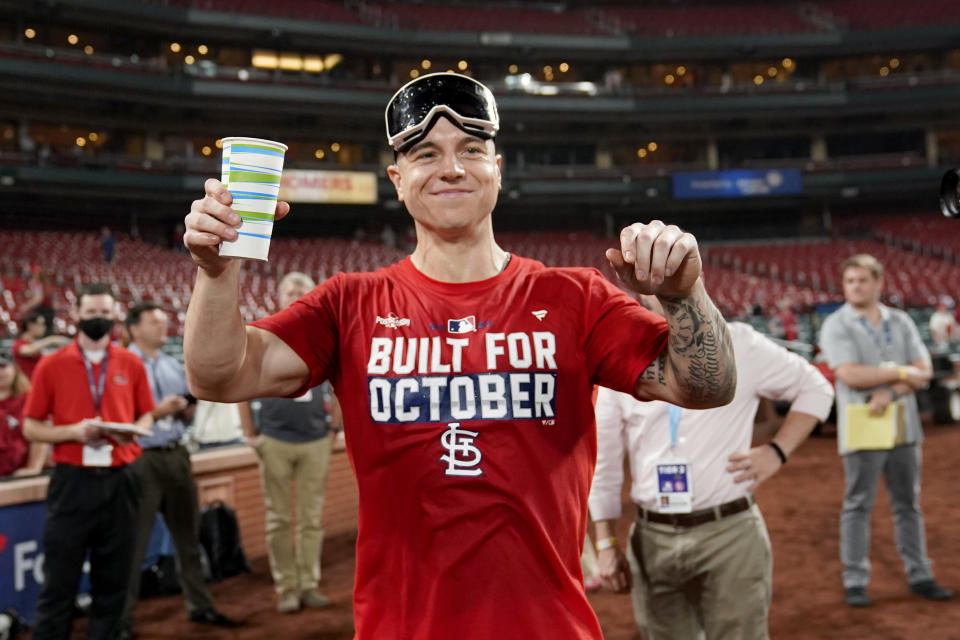 St. Louis Cardinals' Tyler O'Neill celebrates with teammates after defeating the Milwaukee Brewers in a baseball game to clinch a playoff spot Tuesday, Sept. 28, 2021, in St. Louis. (AP Photo/Jeff Roberson)