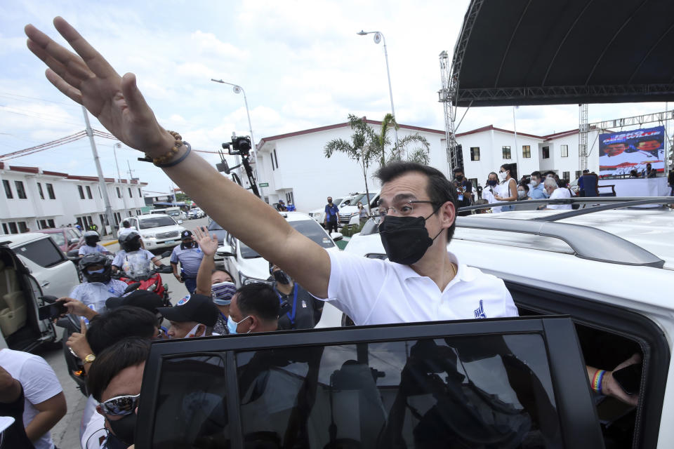 Manila Mayor Isko Moreno waves after he declared his bid to run for president in a speech at a public school in the slum area near the place where he grew up in Manila, Philippines on Wednesday Sept. 22, 2021. The popular mayor of the Philippine capital said Wednesday he will run for president in next year's elections, the latest aspirant in what is expected to be a crowded race to succeed the controversial Rodrigo Duterte. (AP Photo)