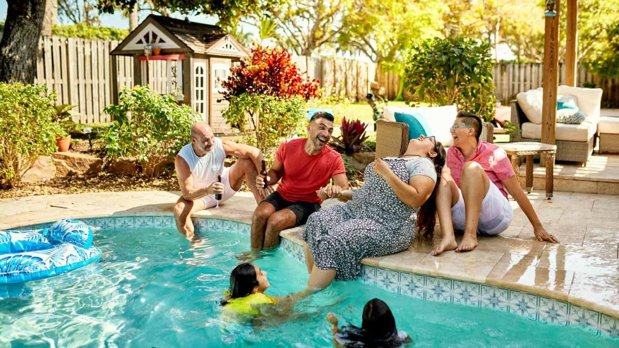 Family having fun in the swimming pool