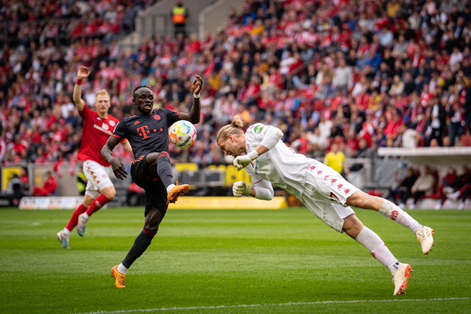 MAINZ, GERMANY - APRIL 22: (EDITORS NOTE: Image has been digitally enhanced.) Sadio Mane of FC Bayern Muenchen kicks the ball under pressure during the Bundesliga match between 1. FSV Mainz 05 and FC Bayern München at MEWA Arena on April 22, 2023 in Mainz, Germany. (Photo by S. Mellar/FC Bayern via Getty Images)