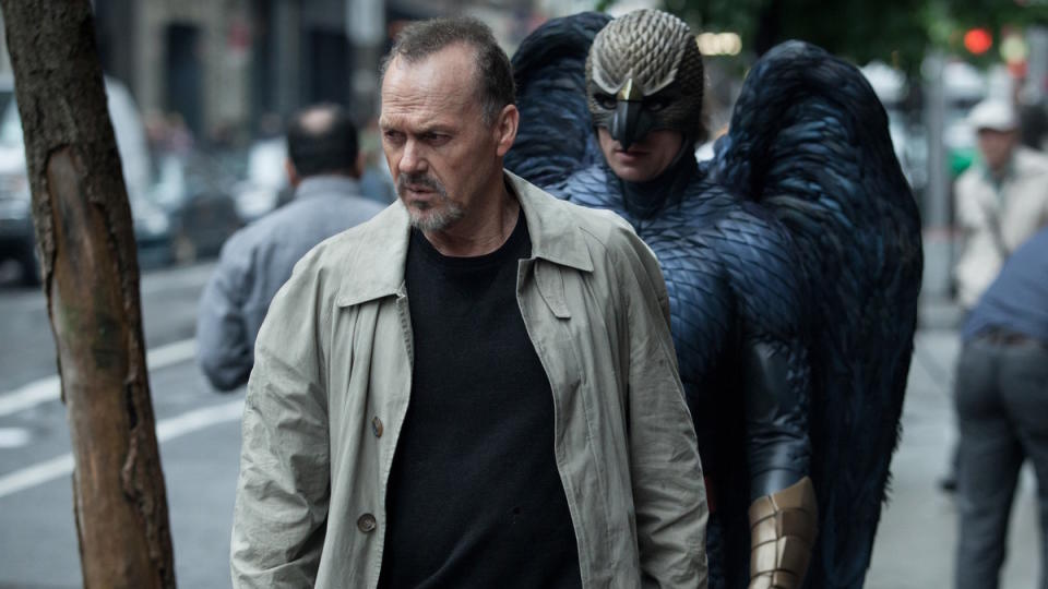 Michael Keaton walks down the street haunted by his Birdman alter ego in Birdman