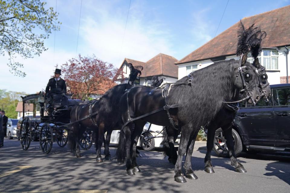 The horse-drawn hearse outside St Francis of Assisi church (Kirsty O’Connor/PA) (PA Wire)