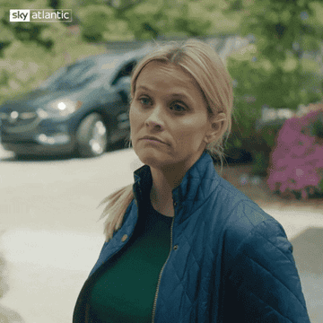 GIF of Reese Witherspoon shrugging