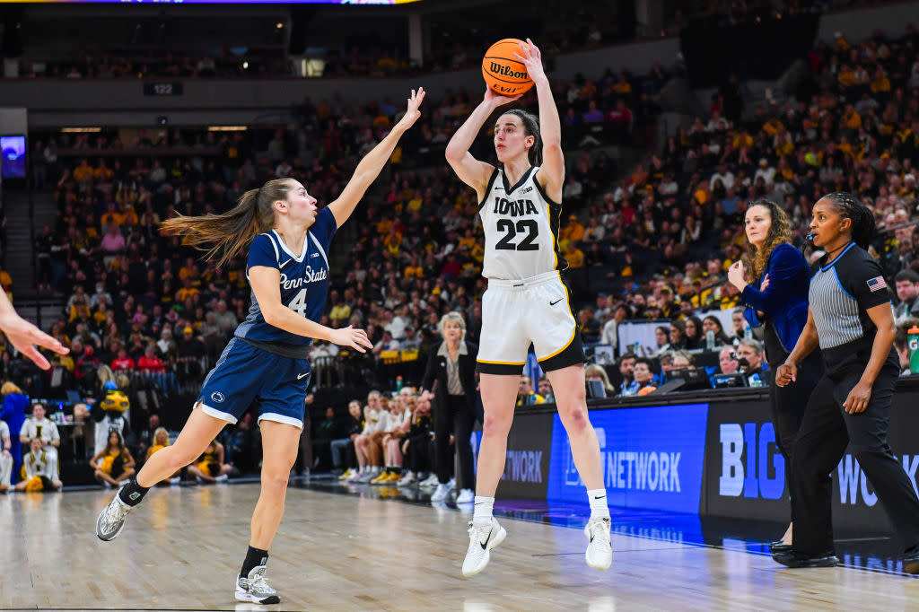  Caitlin Clark #22 of the Iowa Hawkeyes attempts a shot over Shay Ciezki #4 of the Penn State Lady Lions during the first half of a Big Ten Women's Basketball Tournament quarter finals game. 