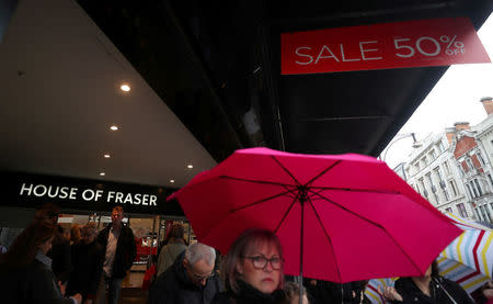 FILE PHOTO: Shoppers walk past House of Fraser on Oxford Street in central London, Britain, April 2, 2018. REUTERS/Hannah McKay/File Photo