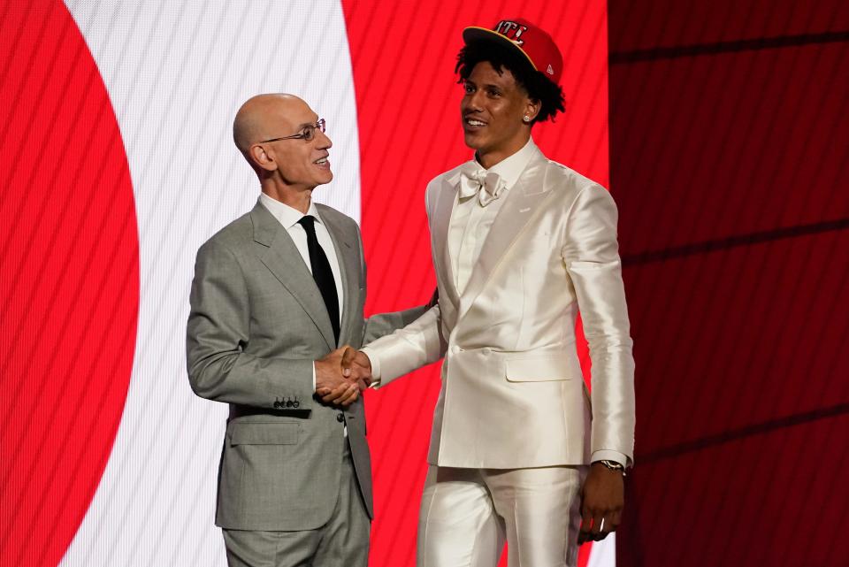 Jalen Johnson greets NBA Commissioner Adam Silver after being selected 20th by the Atlanta Hawks during the NBA draft.