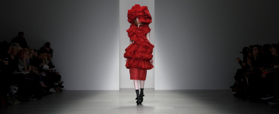 A model wears a design created by John Rocha during London Fashion Week Autumn/Winter 2014, at Somerset House in central London, Saturday, Feb. 15, 2014. (Photo by Jonathan Short/Invision/AP)