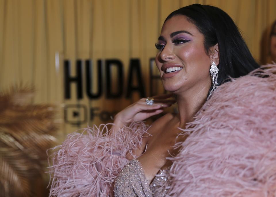 Huda Kattan arrives at the Huda Boss Facebook Watch screening celebration in Dubai, United Arab Emirates, Wednesday, Oct. 9, 2019. (AP Photo/Kamran Jebreili)