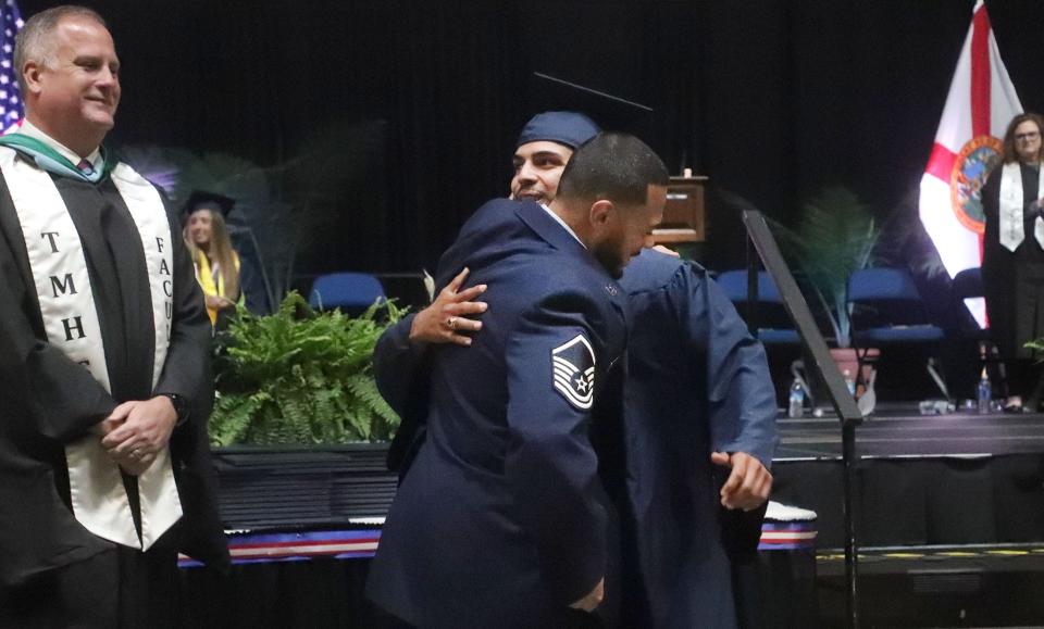 U.S. Air Force Master Sergeant Jose Perez surprises his son Jayden Americo Camacho to present his diploma during the T. DeWitt Taylor Middle-High School Class of 2024 Commencement Exercise, Sunday, May 26, 2024, at the Ocean Center in Daytona Beach.