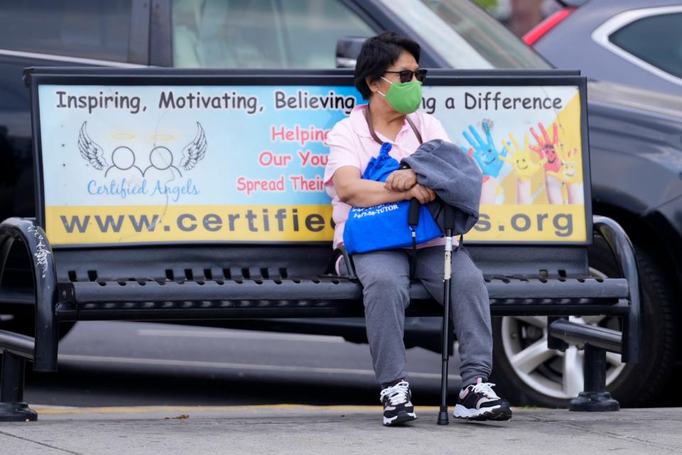 A person wears a mask by Main Ave. in Passaic. Thursday, June 8, 2023.