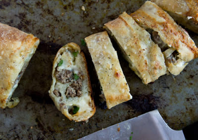 <div class="caption-credit"> Photo by: Photo by Kimberley Hasselbrink</div><b>Blue Cheese and Caramelized Onion Beef Stromboli</b> <br> <br> Stretch 1 pound store-bought pizza dough to fit a standard-sized rimmed baking sheet. Scatter cubes of mozzarella cheese, cooked ground beef, caramelized onions and crumbled blue cheese evenly across the dough, leaving a 1 1/2-inch border. Gently press the toppings into the dough and, beginning at a long end, loosely roll up the dough, pinching the edges together to seal. Bake in a 425° oven until puffed and golden brown, about 20 minutes.