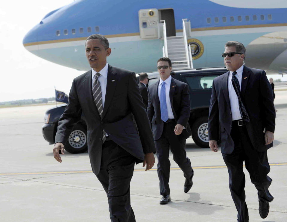 President Barack Obama heads over to greet people after arriving at Eastern Iowa Airport in Cedar Rapids, Iowa, Tuesday, July 10, 2012. (AP Photo/Susan Walsh)