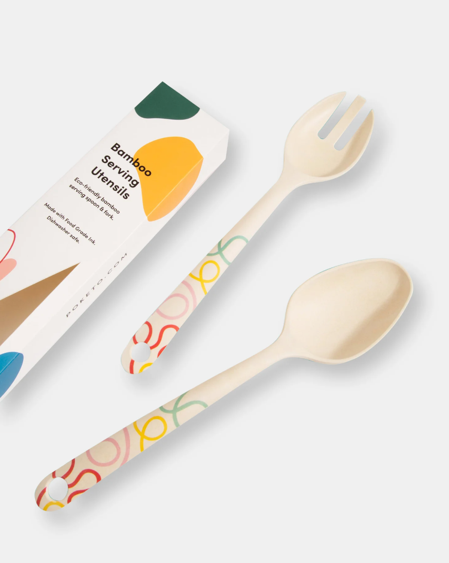 beige bamboo serving utensils with a colorful squiggle design on the handles