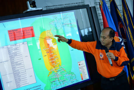 Sutopo Purwo Nugroho, a spokesman of Indonesia's disaster mitigation agency BNPB, holds a news conference to brief on the latest situation after a strong quake and tsunami hit at Sulawesi island, at the BNPB headquarters in Jakarta, Indonesia, September 29, 2018. Antara Foto/Aprillio Akbar via REUTERS