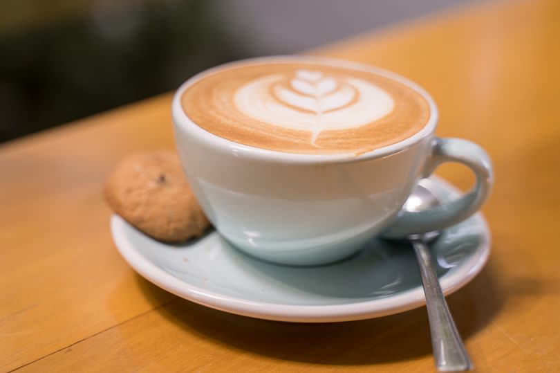 Cup of coffee with latte art in coffee shop