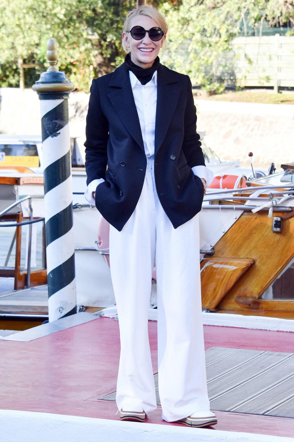 <p>Blanchett is a pro at wearing simple, classic ensembles — and looking impeccably stylish while she's at it. She added a navy blazer to the ensemble upon arrival and transformed the outfit. </p>