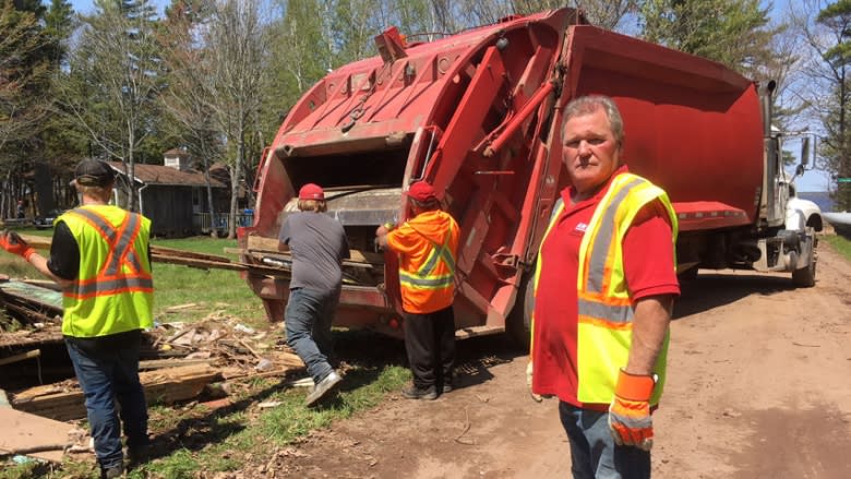 Flood debris pickup at Grand Lake has company working flat-out