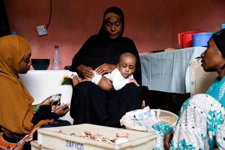 The Wider Image: Tanzania's Zanzibar begins to register traditional healers