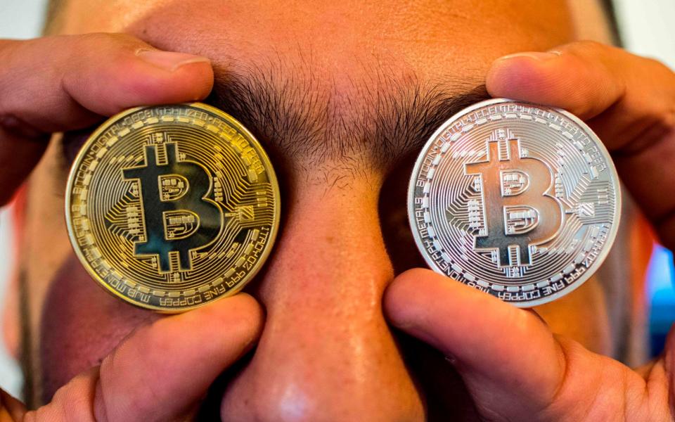 The debate over whether cryptocurrency will ever replace traditional banking continues - AFP