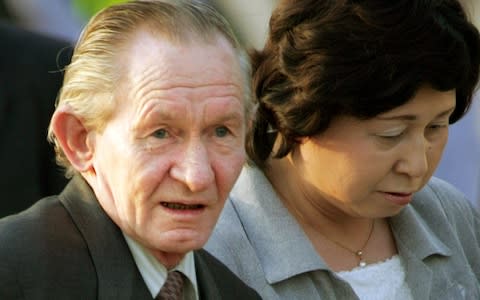 Former U.S. army sergeant Charles Robert Jenkins is escorted by his Japanese wife Hitomi Soga  - Credit: Reuters